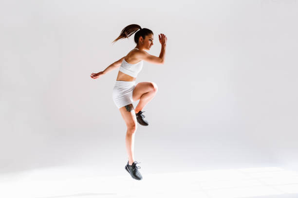 istock Young female athlete training in a gym using sport equipment 1480103054