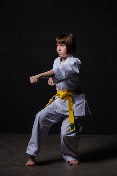 istock A karate girl trains in a kimono with punches and kicks 1480103080