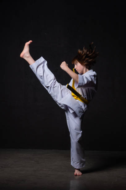 istock A karate girl trains in a kimono with punches and kicks 1480103111