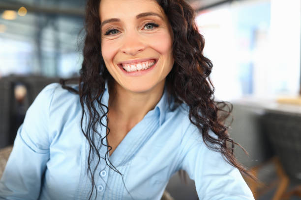 istock Charming girl in a blouse smiles broadly closeup 1480103221