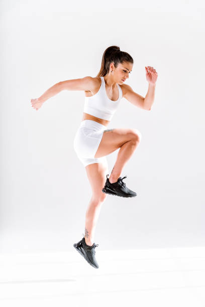 istock Young female athlete training in a gym using sport equipment 1480103382