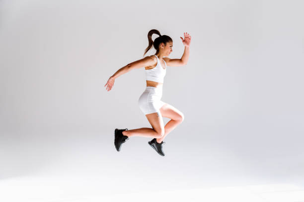 istock Young female athlete training in a gym using sport equipment 1480103781
