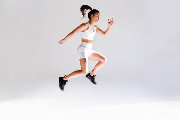 istock Young female athlete training in a gym using sport equipment 1480103890
