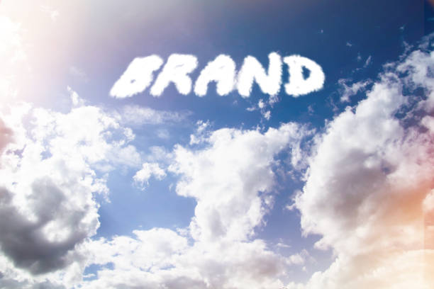 istock Brand inscription in clouds. Bright sun glare illuminates text in sky. 1480105030