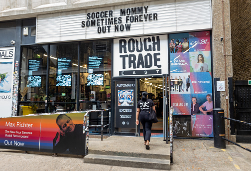 London. UK-06.26.2022. The shop front and logo of Rough Trade East in Brick Lane Market. A store which specialise in old music recordings.