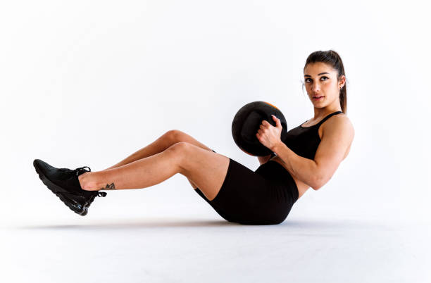 istock Young female athlete training in a gym using sport equipment 1480105668