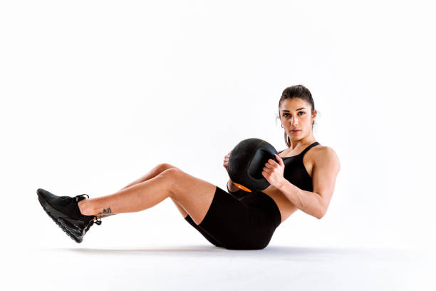 istock Young female athlete training in a gym using sport equipment 1480106578