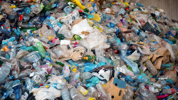 istock Heap of plastic garbage at waste sorting plant 1480106660