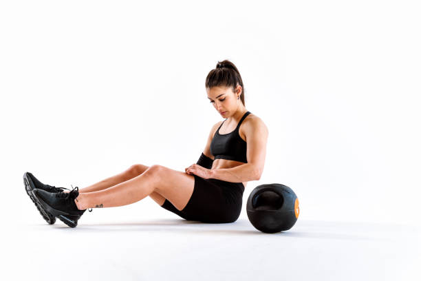 istock Young female athlete training in a gym using sport equipment 1480106820