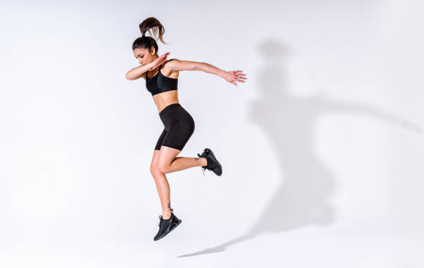 istock Young female athlete training in a gym using sport equipment 1480107252
