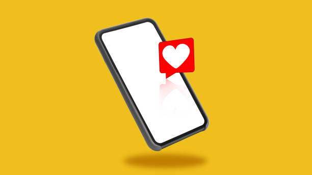 istock Smartphone With Empty Screen And Heart Icon Over Yellow Background 1480108010
