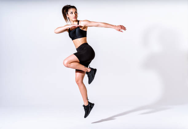 istock Young female athlete training in a gym using sport equipment 1480108279