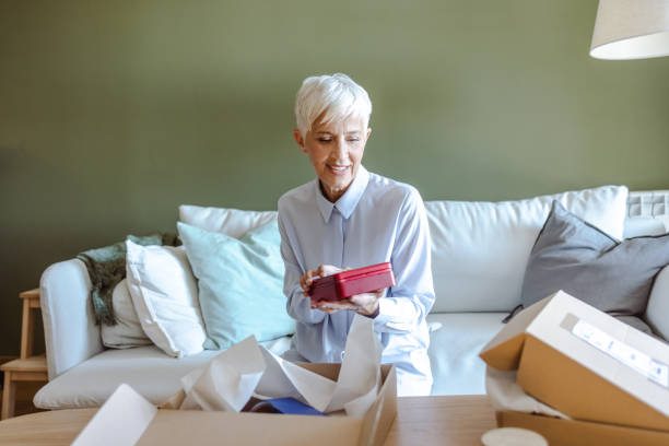 istock Senior woman received order from an online store 1480108464