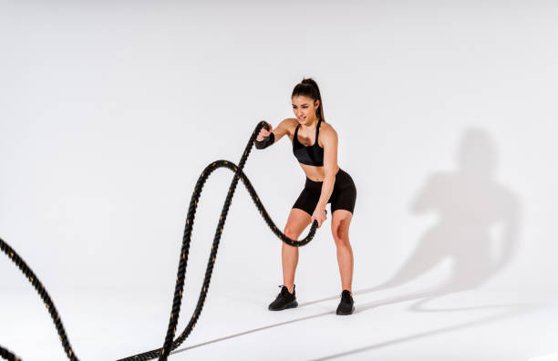 istock Young female athlete training in a gym using sport equipment 1480108763