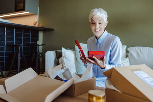 istock Senior woman received order from an online store 1480109402