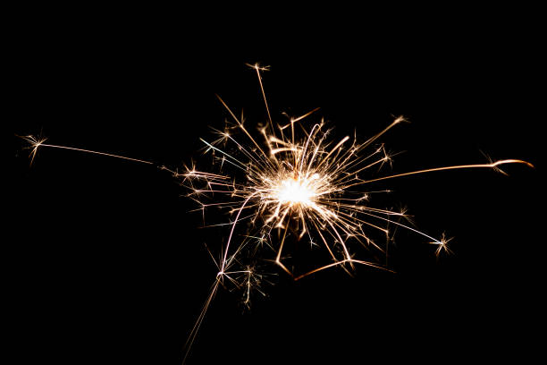 istock Burning sparkler isolated on black background. Fireworks theme. Light effect and texture. 1480109436