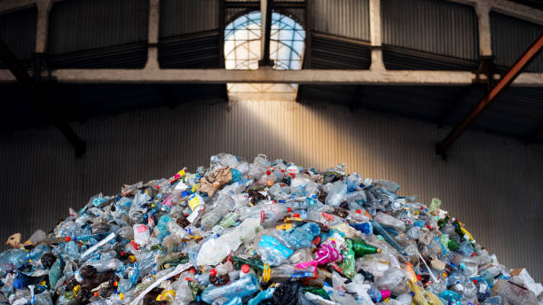 istock Heap of plastic garbage at waste sorting plant 1480109832