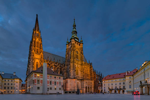 Prague castle square in blue hours in cloudy spring evening stock photo