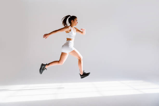 istock Young female athlete training in a gym using sport equipment 1480112257