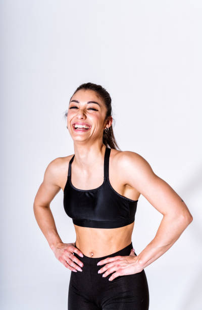 istock Young female athlete training in a gym using sport equipment 1480112455