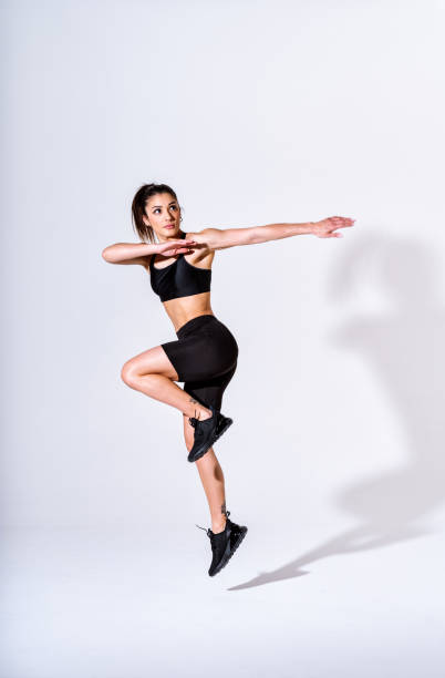 istock Young female athlete training in a gym using sport equipment 1480112680