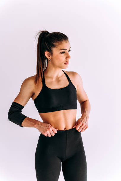 istock Young female athlete training in a gym using sport equipment 1480112979