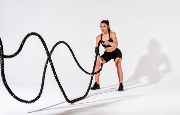 istock Young female athlete training in a gym using sport equipment 1480113999