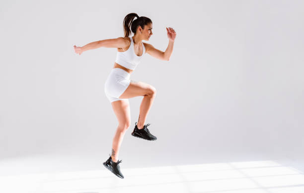 istock Young female athlete training in a gym using sport equipment 1480114260