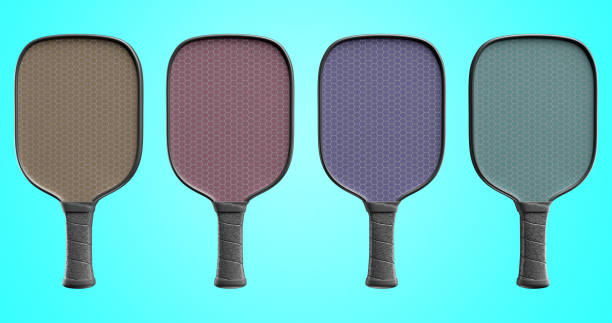 multi-colored pickleball rackets with a black handle in a row on an isolated background. 3d rendering - number number 4 three dimensional shape green imagens e fotografias de stock