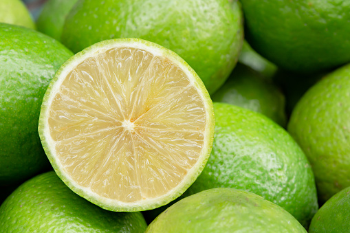 Lime slice citrus fruits background. Fresh juicy limes. Healthy food