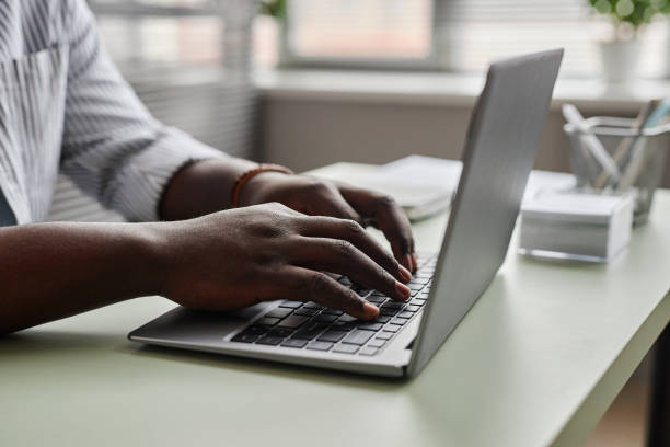 istock Close up of unrecognizable black man working online 1480122952