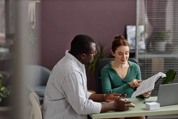 istock Minimal two people working together in office with copy space 1480123005