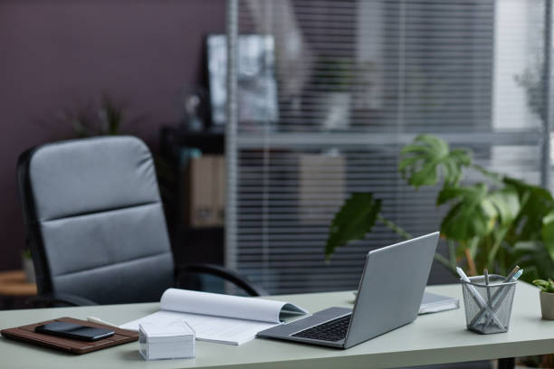 istock Background image of modern workplace desk in office decorated with plants 1480123007