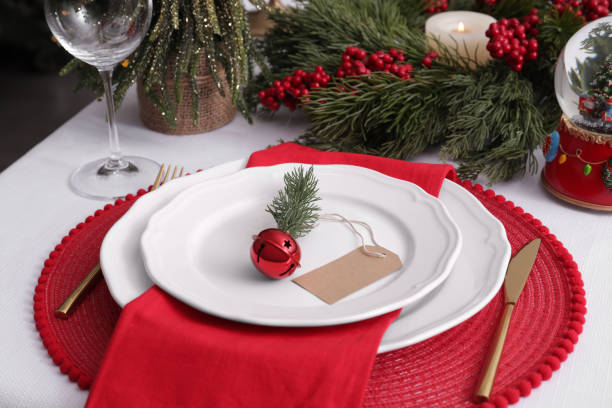 istock Luxury place setting with beautiful festive decor for Christmas dinner on white table, closeup 1480127332