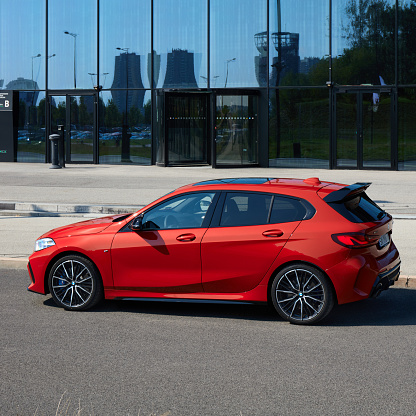 BMW M135i in front of the building of the International Congress Center. Model F40, produced from 2019. 306 HP engine, acceleration 0-100 km-h - 4.8 s Katowice, Poland- 09.16.2020