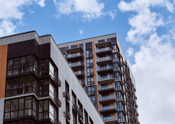 istock Modern residential skyscraper and beautiful blue sky and bright white clouds. 1480134300