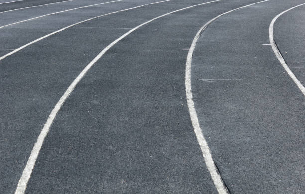 istock Treadmill with white lines at the stadium close up. Running tracks with marking. 1480134907
