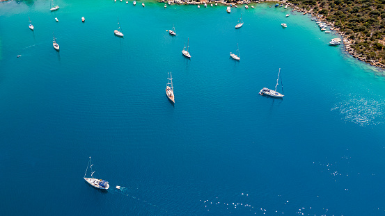 Top view of Turkish coastline with different boats. The turquoise coast for holidays , backdrop of stunning mountain scenery. Kas, Turkey.