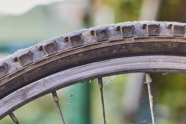 istock Part of a bicycle wheel tire. Old bicycle wheel. 1480139726