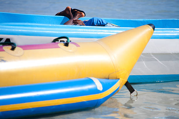 Tourists having fun by doing water sports Ringo in the sea