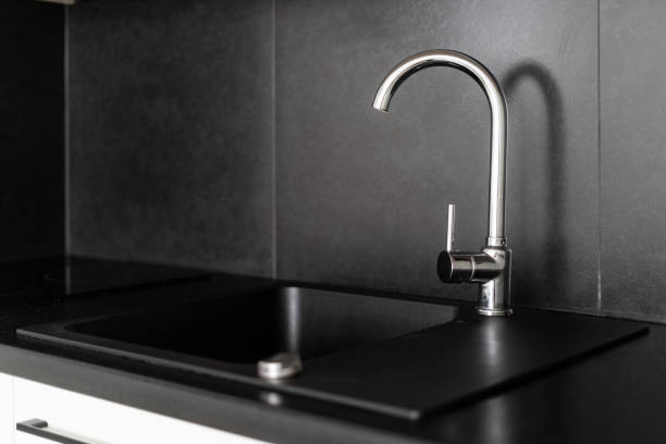 istock silver water tap and sink at modern apartment 1480143039