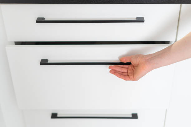 istock closeup of woman opening drawer on kitchen 1480143093
