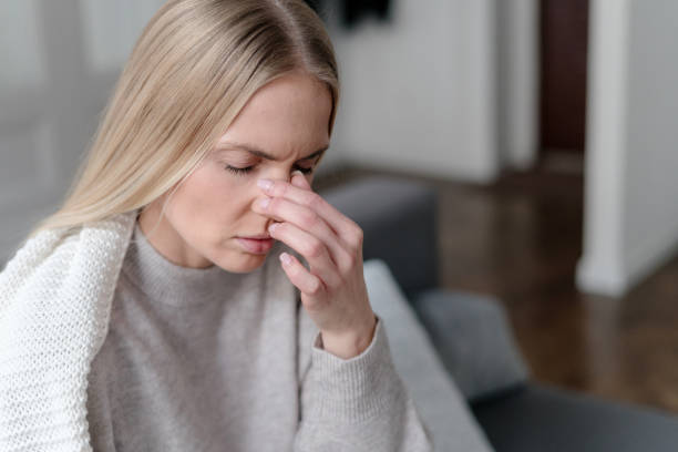 istock sick woman with sinusitis and pressure feel unwell 1480143515