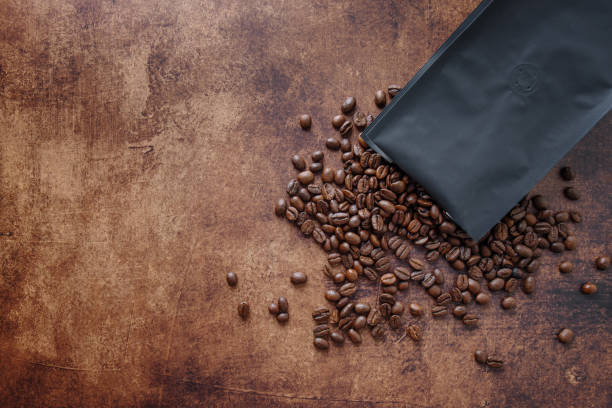 istock Coffee beans on wooden old background 1480145675