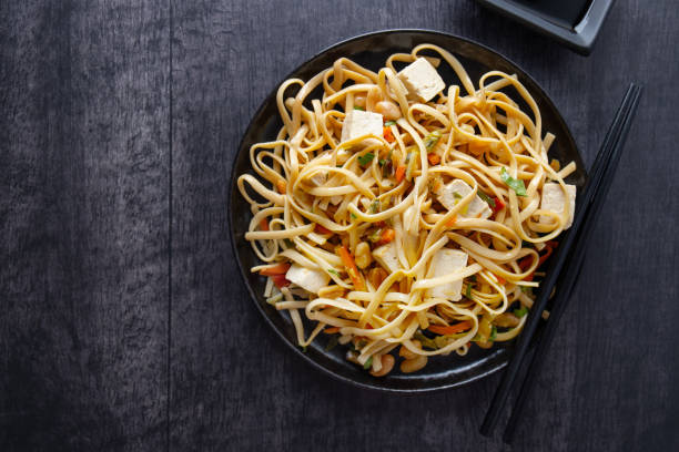 istock Vegan noodles with tofu and vegetables 1480146076