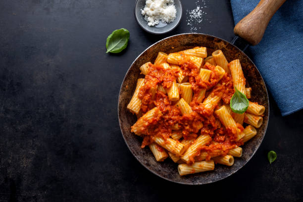 istock Pasta with tomato sauce served on pan 1480146673