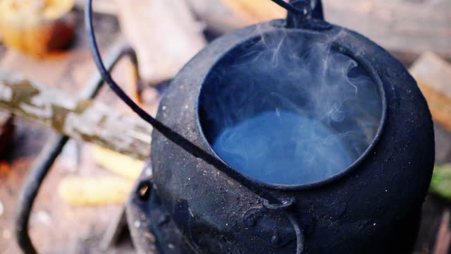 Dirty kettle in the outdoor fireplace