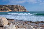 istock Waves of mediterranean sea with foam on the beach in Javea city, Spain 1480150266