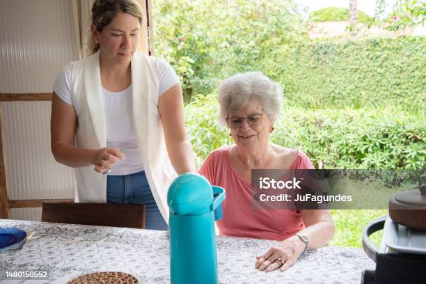 Elderly Caregiver Coffee Time Stock Photo - Download Image Now - Home Caregiver, Assisted Living, Individuality
