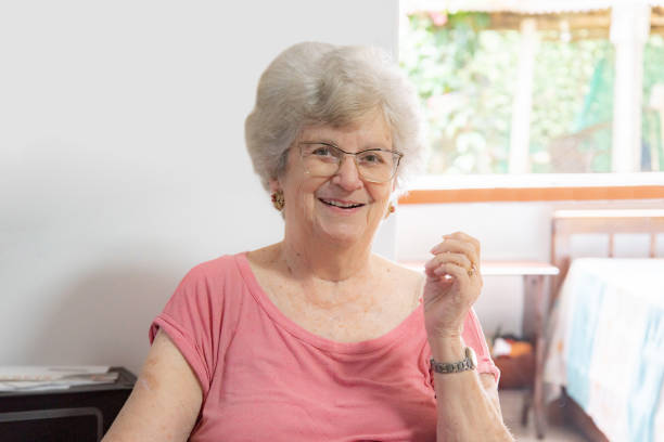 istock Elderly lady holding cup in the garden 1480150599